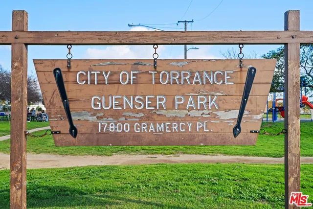 a view of outdoor space with playground and green space