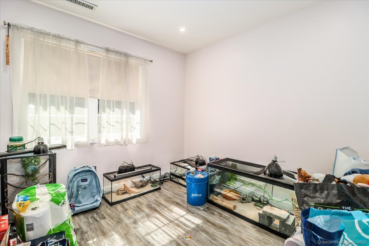 35 Hillendale Drive New Milford, CT 06776 - Photo 21 of 39 a room with furniture a rug and a window