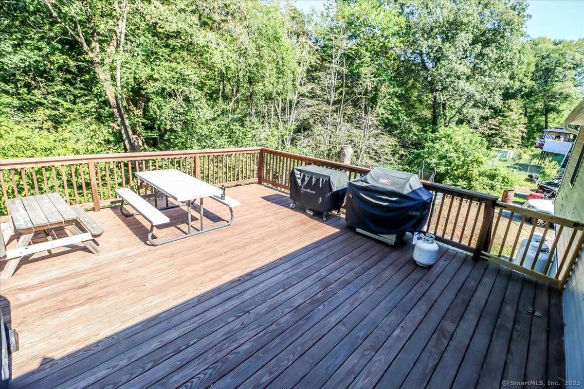 35 Hillendale Drive New Milford, CT 06776 - Photo 25 of 39 a view of a balcony with wooden floor and outdoor seating