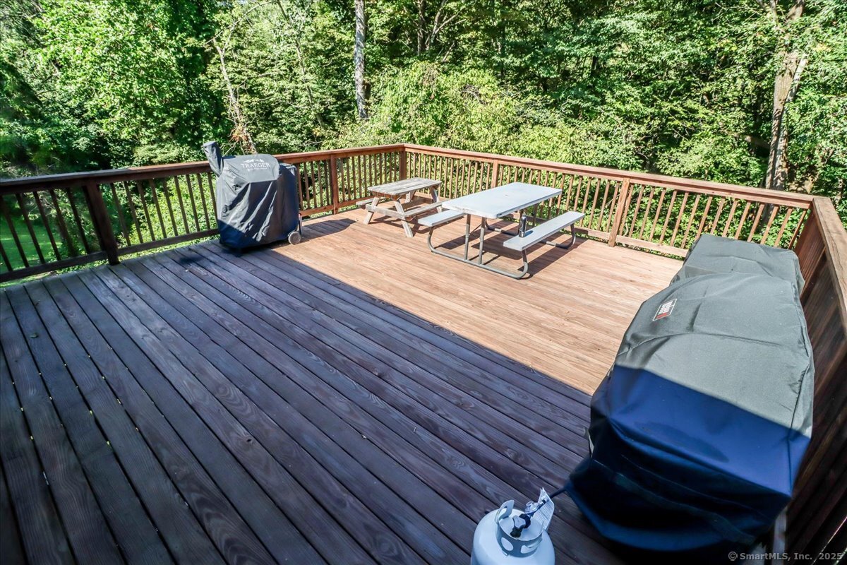 35 Hillendale Drive New Milford, CT 06776 - Photo 26 of 39 a balcony with wooden floor table and chairs