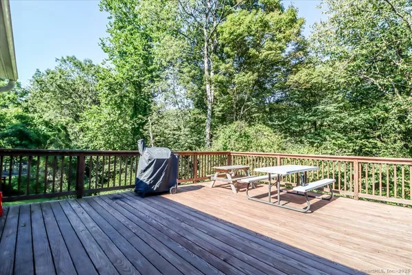 a view of balcony with furniture and wooden floor