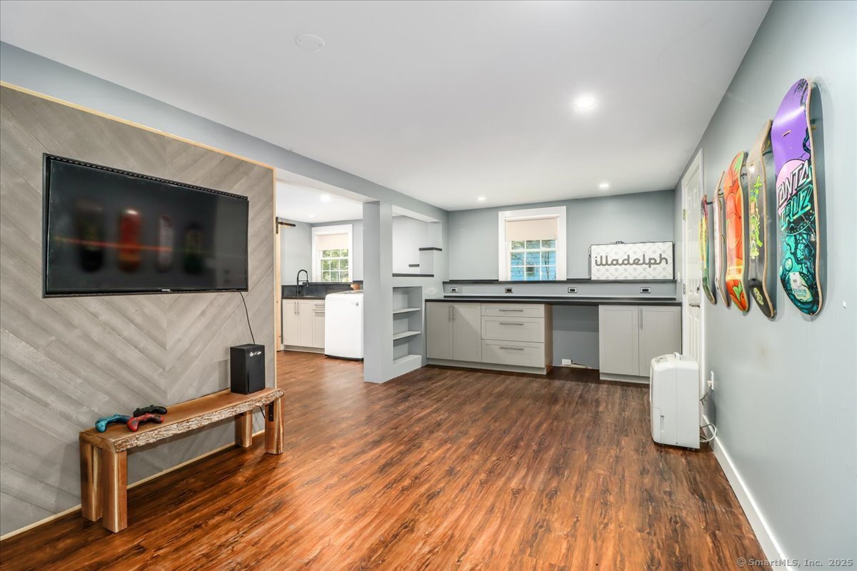 35 Hillendale Drive New Milford, CT 06776 - Photo 34 of 39 a living room with stainless steel appliances furniture and a flat screen tv