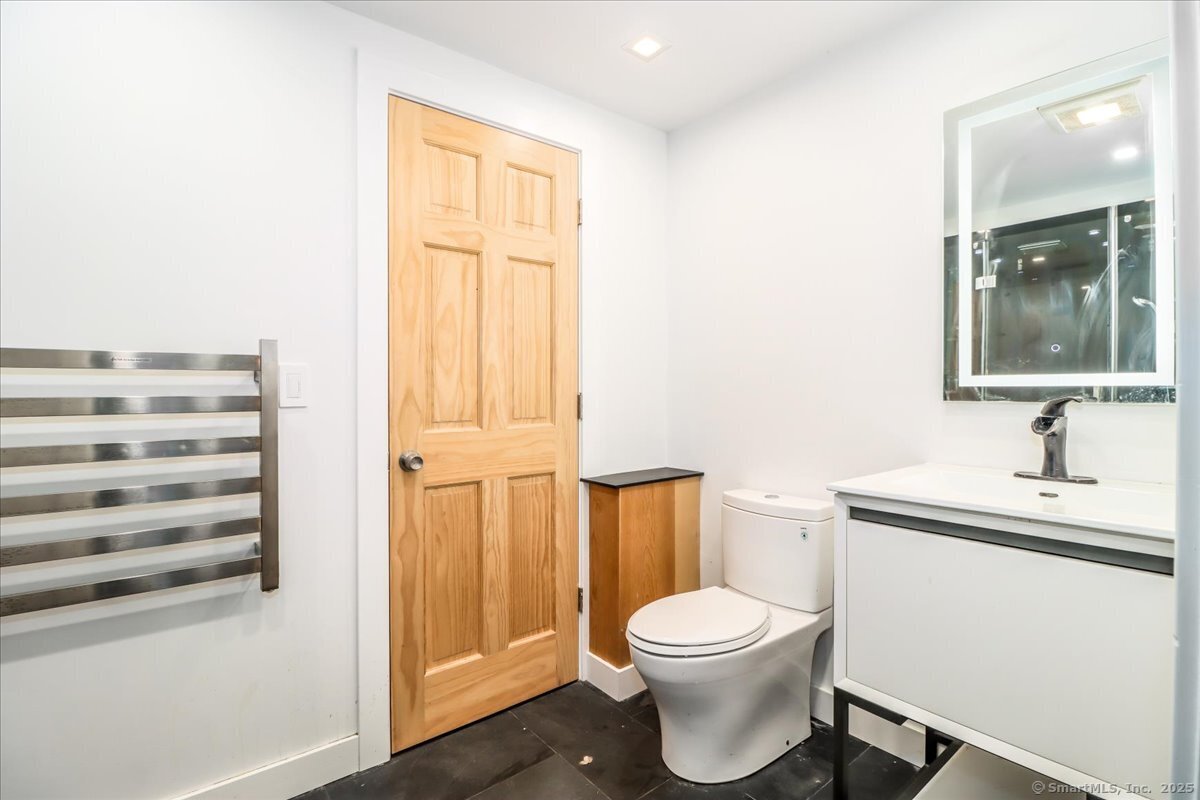 35 Hillendale Drive New Milford, CT 06776 - Photo 37 of 39 a bathroom with a toilet a sink and a window