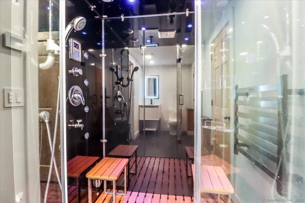 a bathroom with a glass shower door