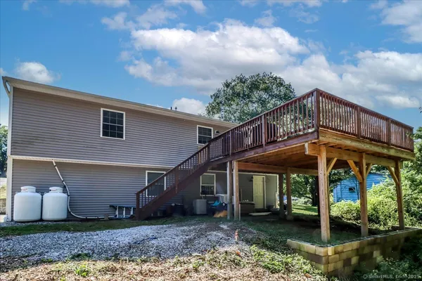 a view of a house with porch and wooden floor