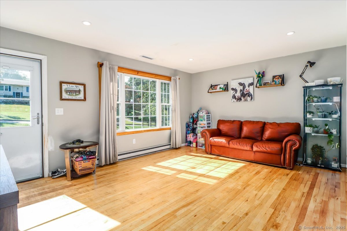 35 Hillendale Drive New Milford, CT 06776 - Photo 7 of 39 a view of a livingroom with furniture and a window