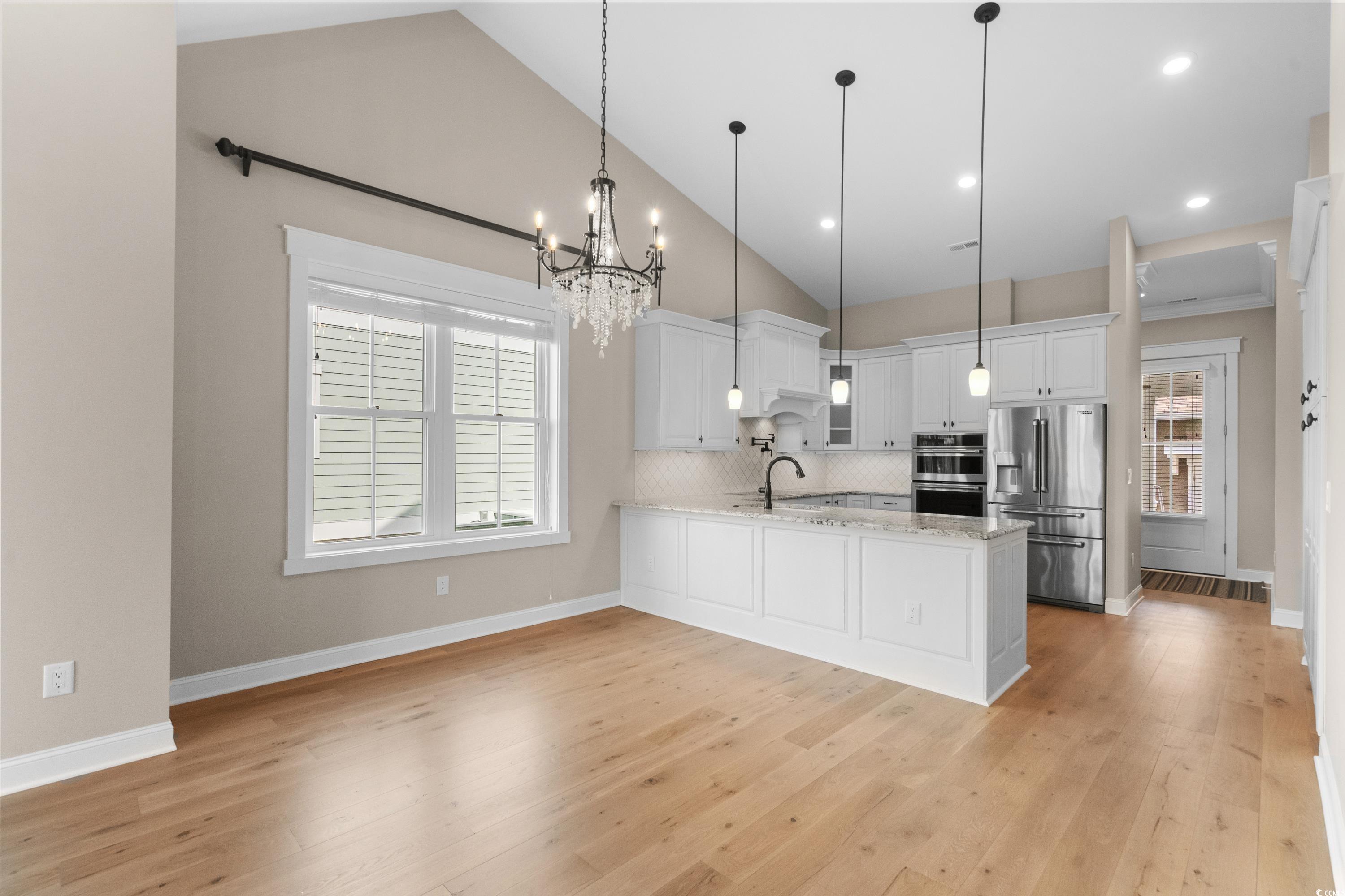 8159 Sandlapper Way Myrtle Beach, SC 29572 - Photo 16 of 39 Kitchen with pendant lighting, stainless steel app