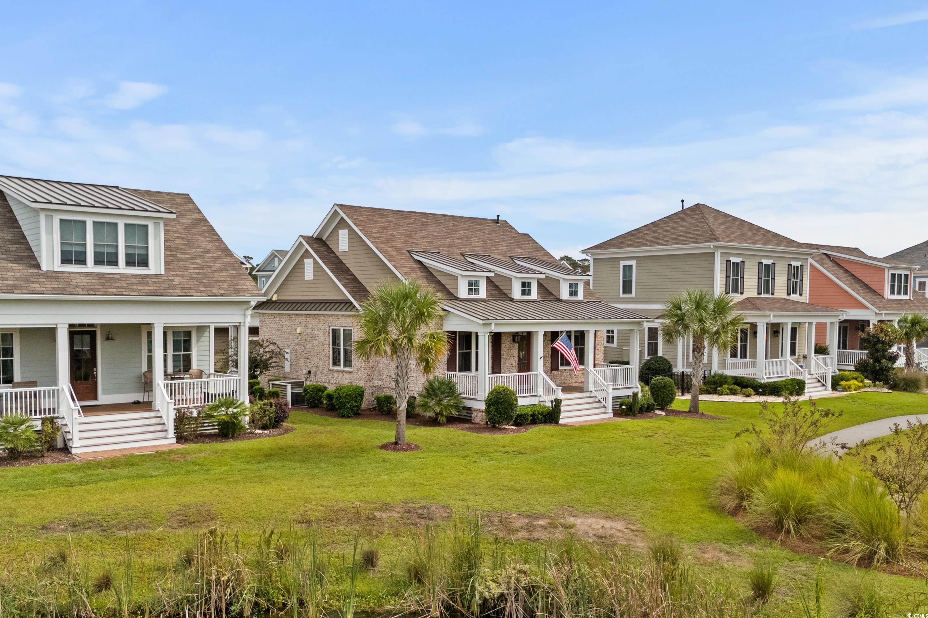 8159 Sandlapper Way Myrtle Beach, SC 29572 - Photo 2 of 39 View of front of property featuring a front lawn a