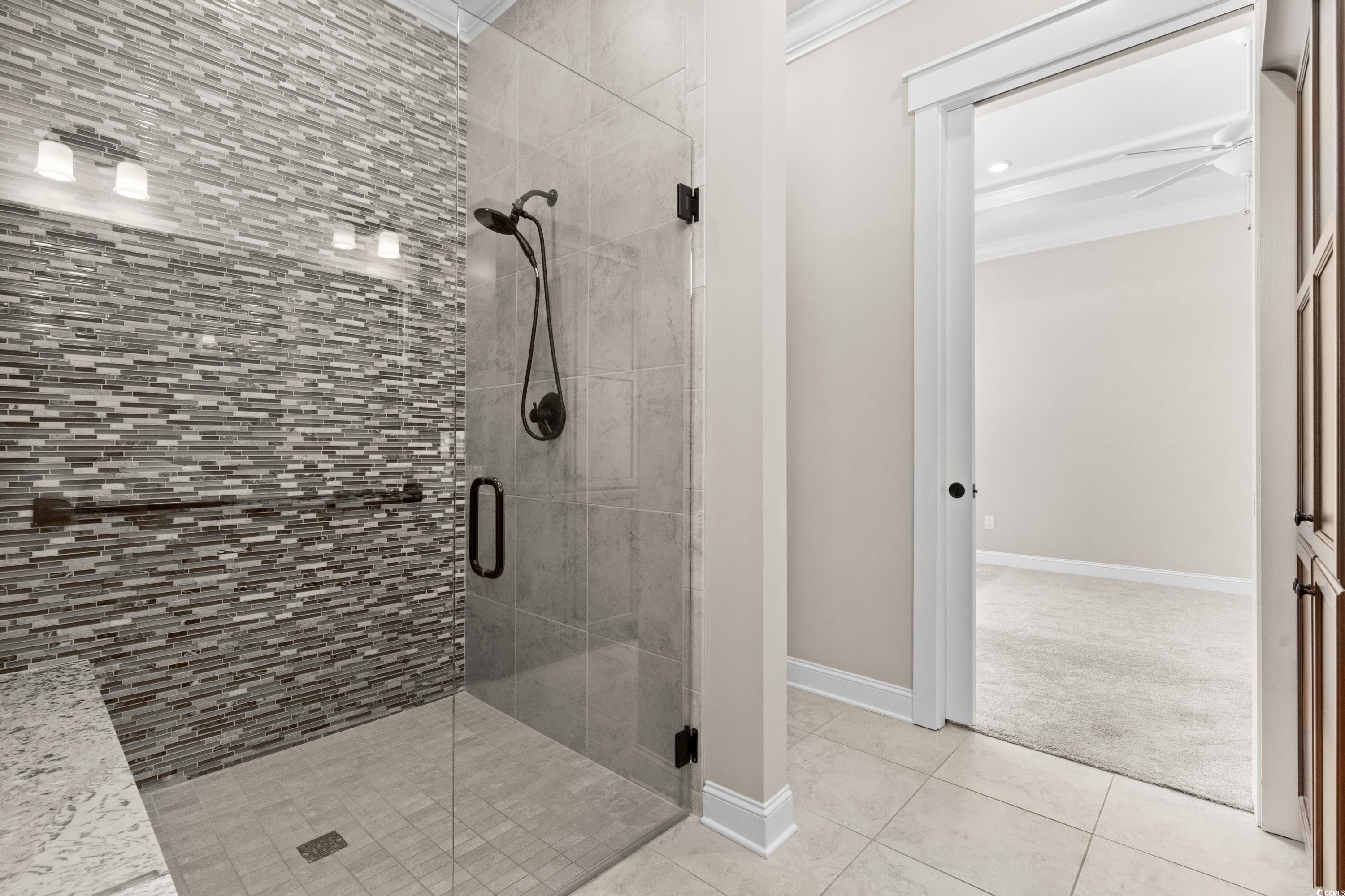 8159 Sandlapper Way Myrtle Beach, SC 29572 - Photo 24 of 39 Bathroom featuring crown molding, tile patterned f