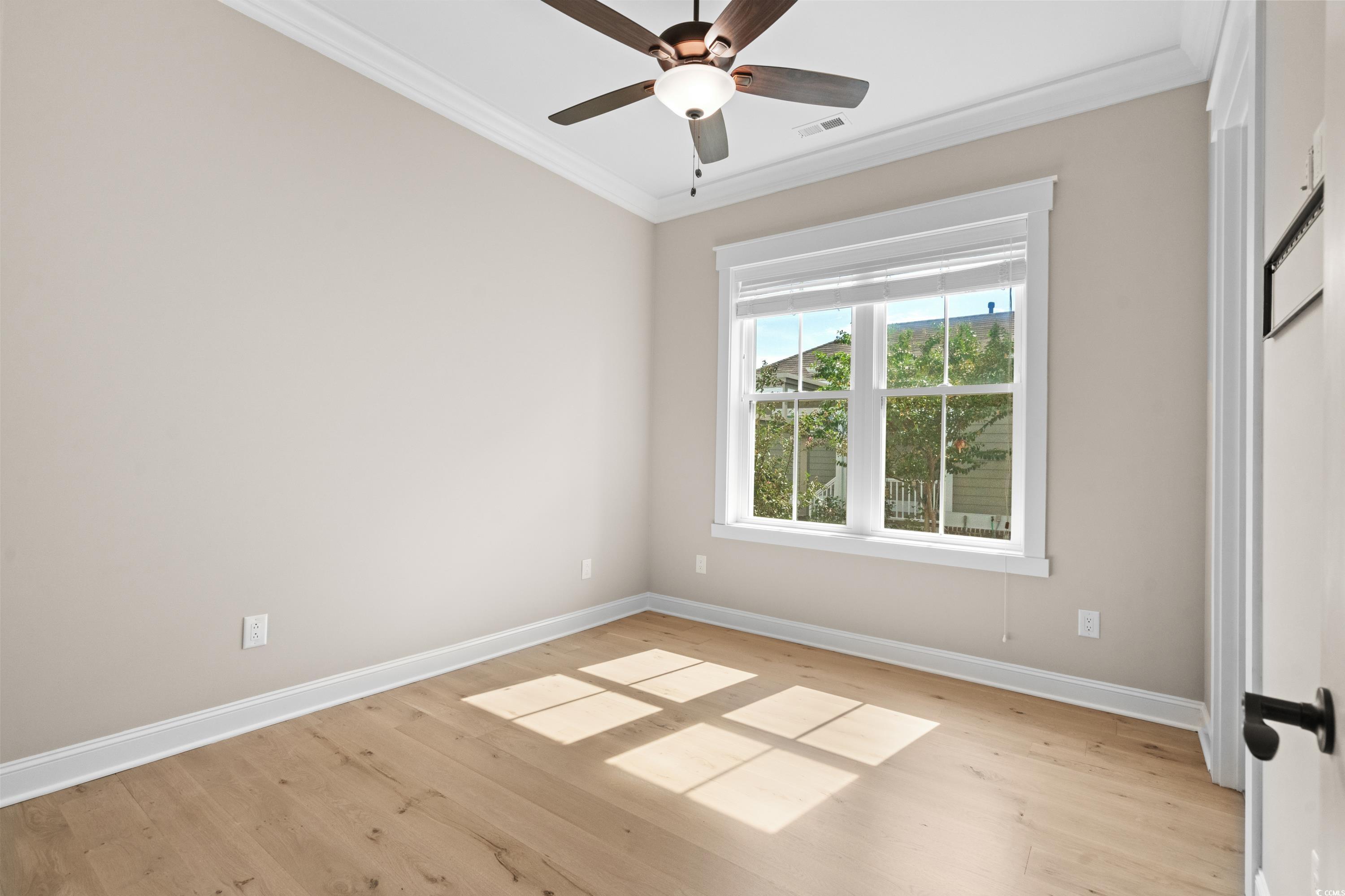 8159 Sandlapper Way Myrtle Beach, SC 29572 - Photo 26 of 39 Spare room with light wood-type flooring, ceiling