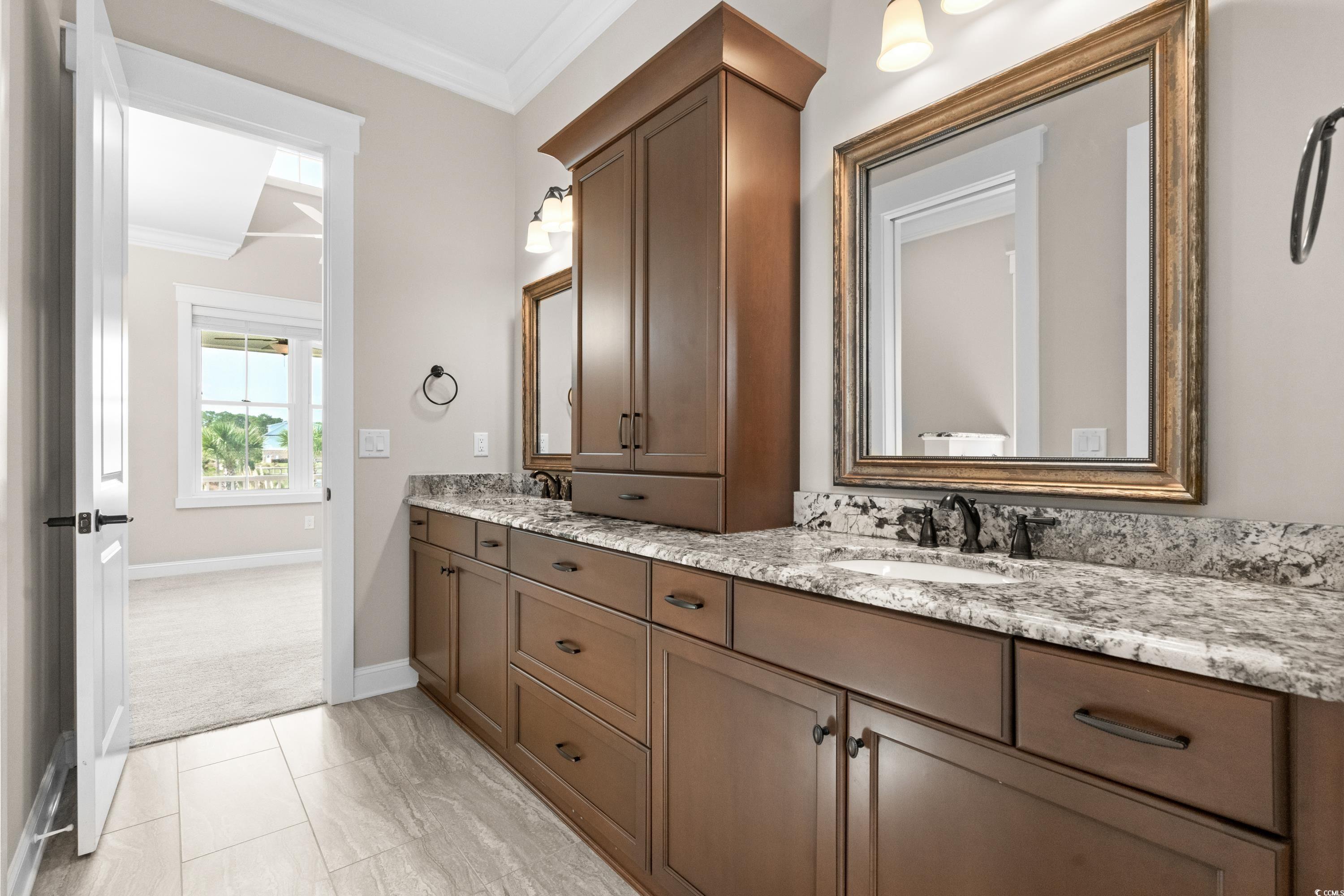 8159 Sandlapper Way Myrtle Beach, SC 29572 - Photo 27 of 39 Bathroom featuring crown molding, vanity, and toil