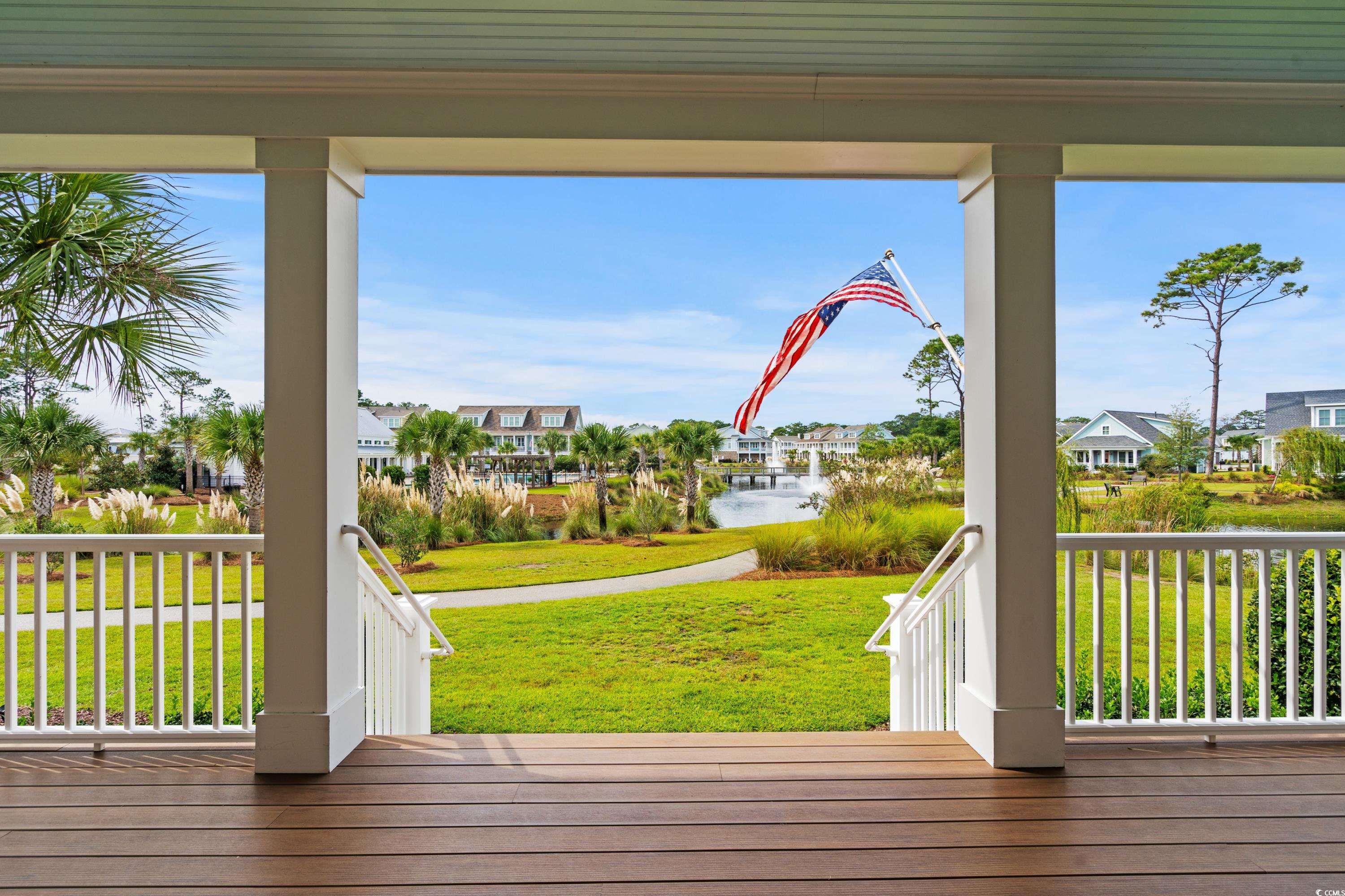 8159 Sandlapper Way Myrtle Beach, SC 29572 - Photo 3 of 39 Deck with a water view and a yard