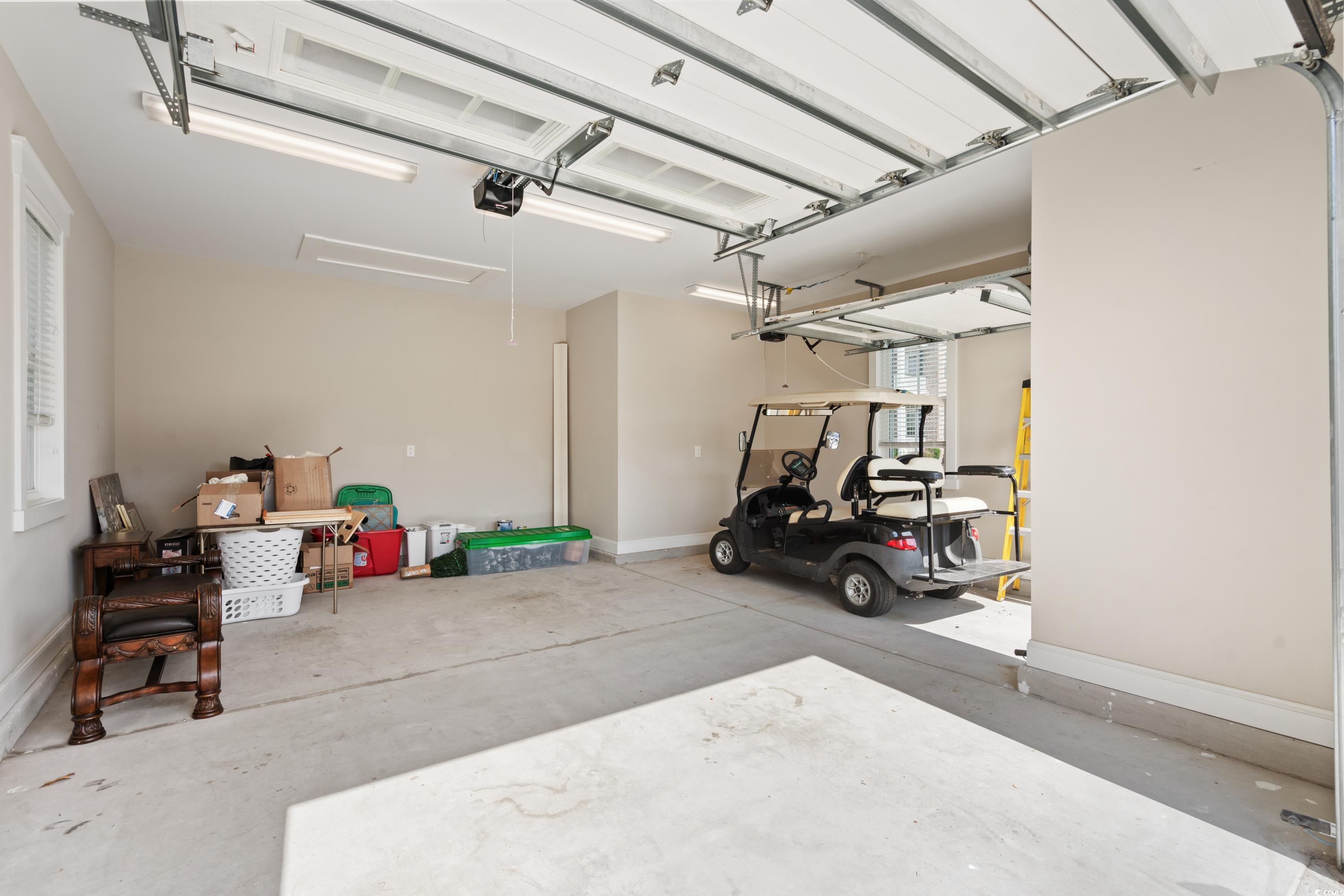 8159 Sandlapper Way Myrtle Beach, SC 29572 - Photo 32 of 39 Garage with a garage door opener
