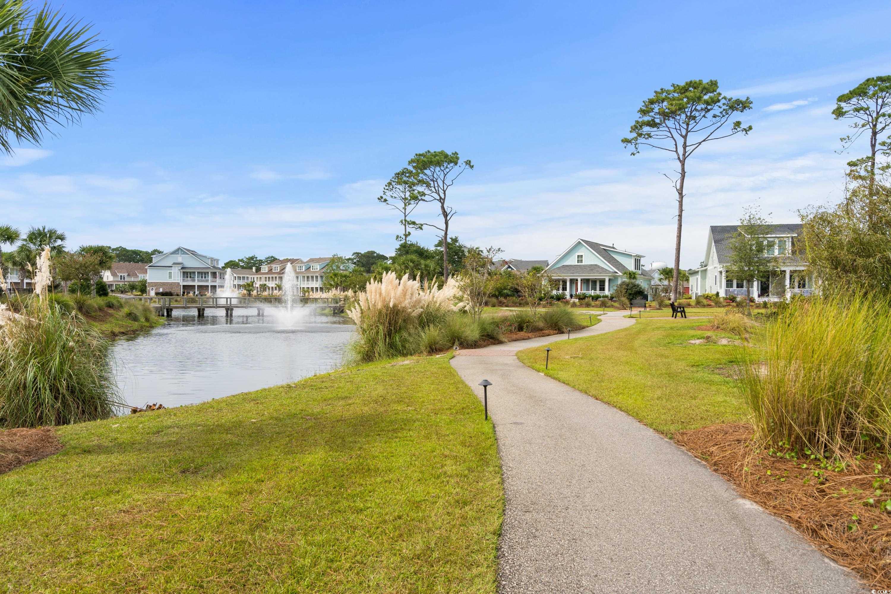 8159 Sandlapper Way Myrtle Beach, SC 29572 - Photo 5 of 39 Exterior space featuring a lawn and a water view