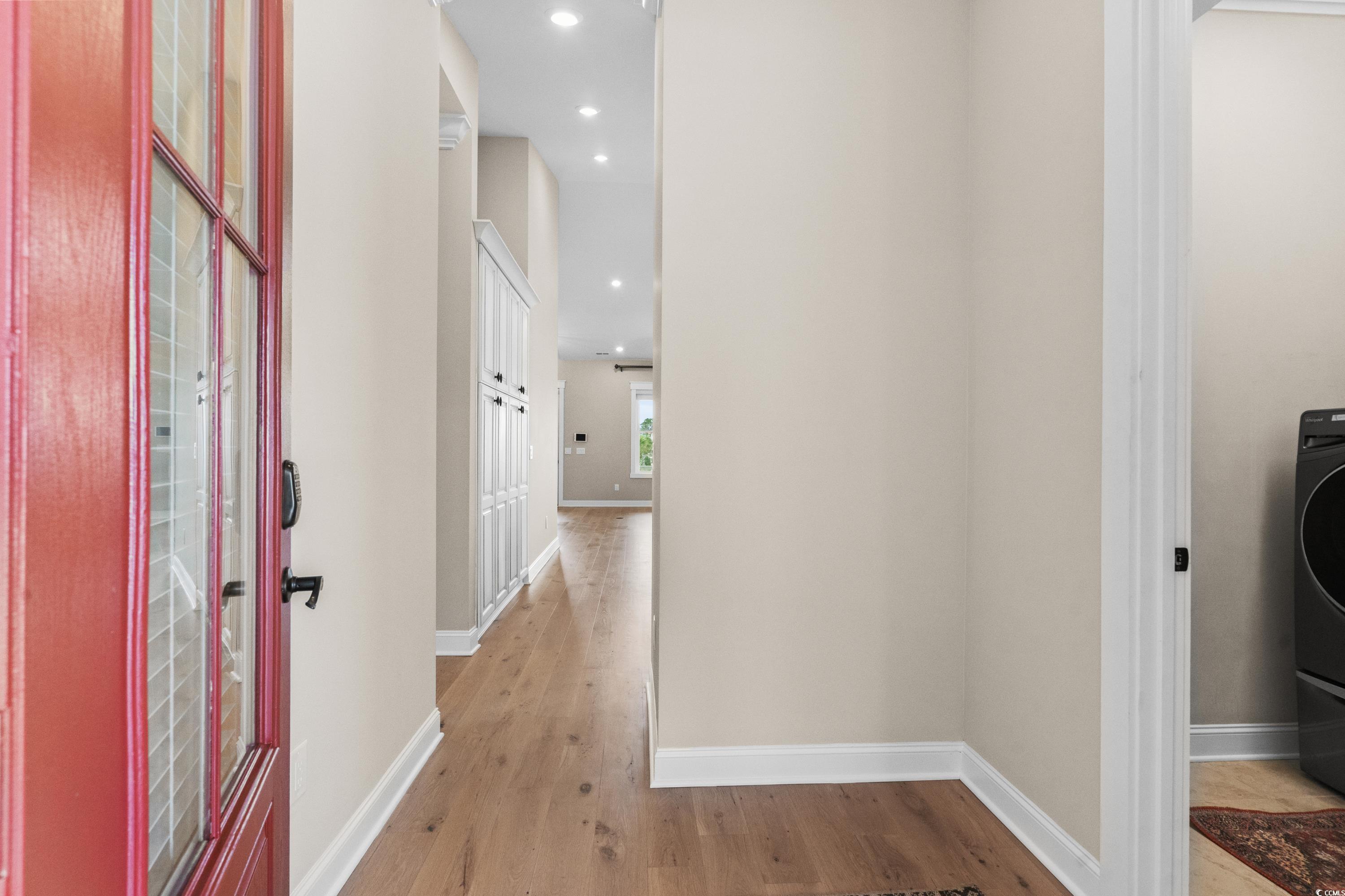 8159 Sandlapper Way Myrtle Beach, SC 29572 - Photo 9 of 39 Hallway with light hardwood / wood-style flooring