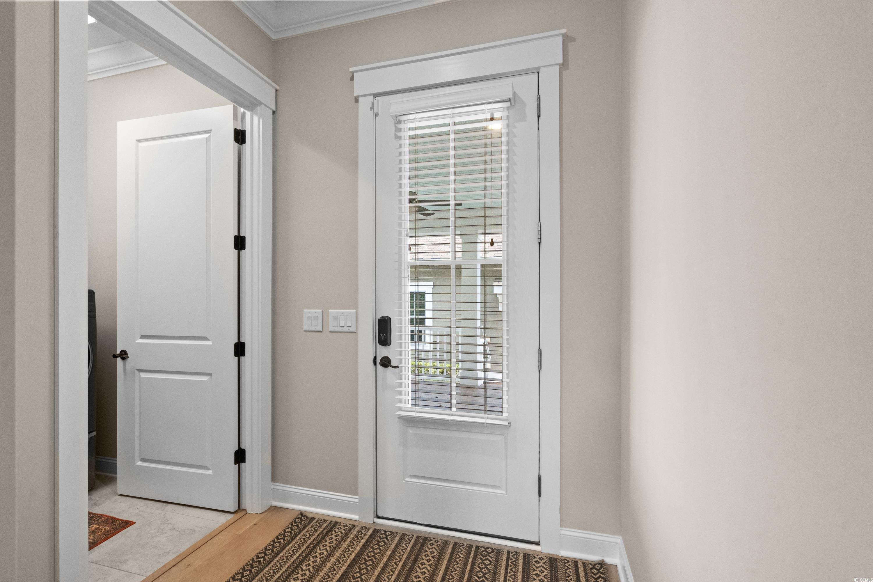 8159 Sandlapper Way Myrtle Beach, SC 29572 - Photo 10 of 39 Entryway featuring light hardwood / wood-style flo