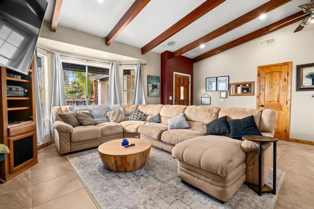 8321 Sheila Street El Cajon, CA 92021 - Photo 15 of 26 a living room with furniture and a large window