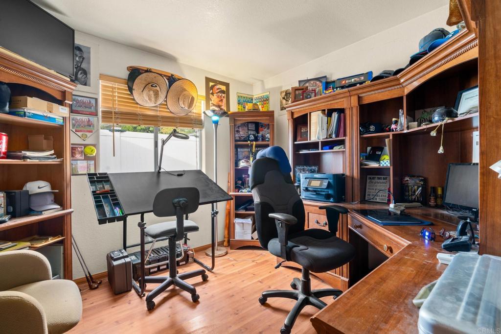 8321 Sheila Street El Cajon, CA 92021 - Photo 22 of 26 a view of a livingroom with furniture and a bookshelf