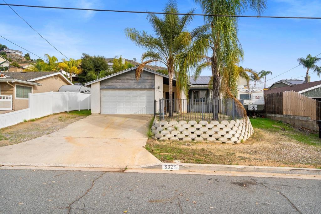 8321 Sheila Street El Cajon, CA 92021 - Photo 3 of 26 front view of a house with a yard