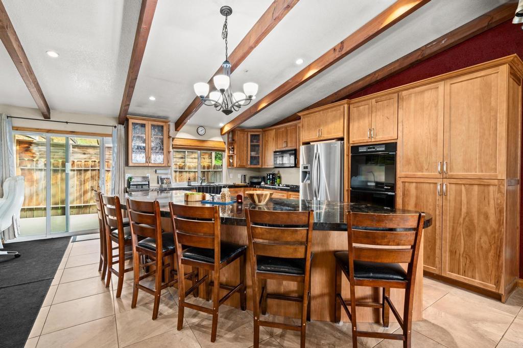 8321 Sheila Street El Cajon, CA 92021 - Photo 10 of 26 a view of a dining room with furniture window and wooden floor
