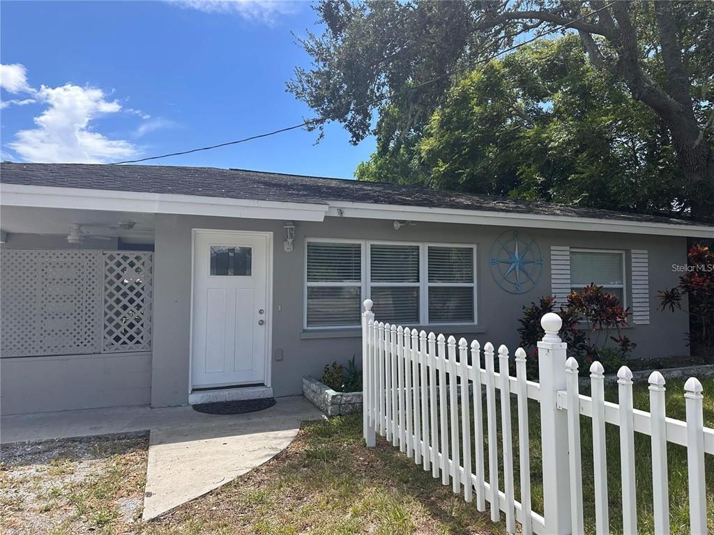 a view of a house with a small yard