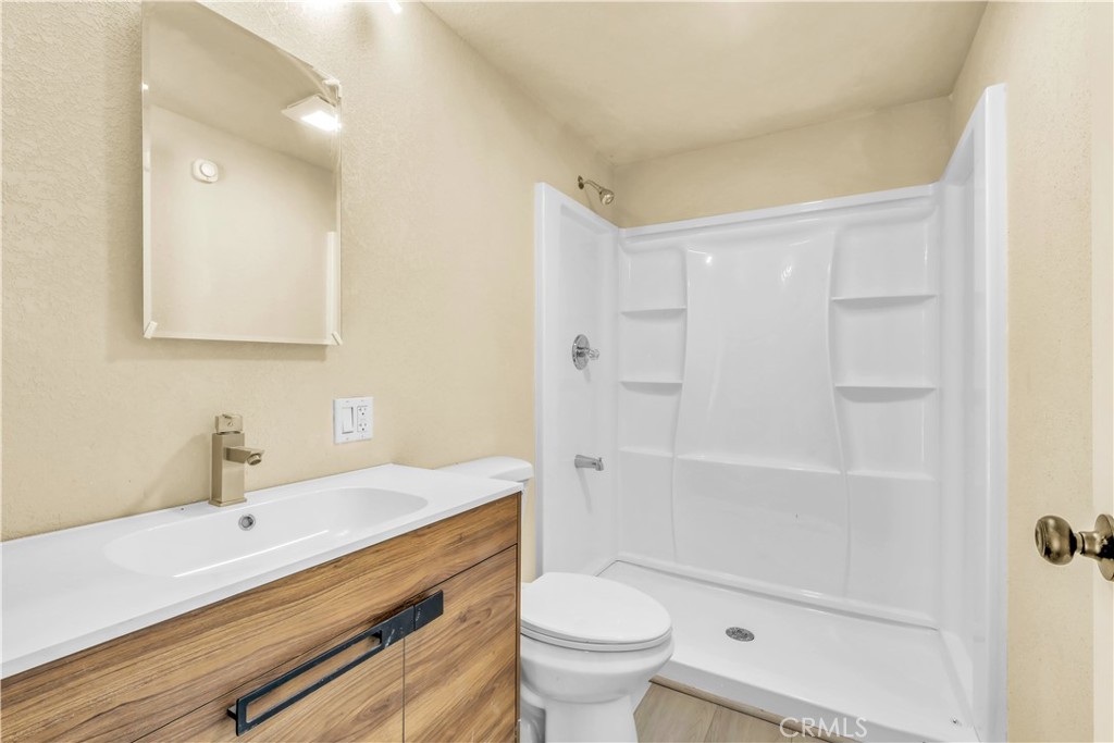 15905 Kugelman Street Lower Lake, CA 95457 - Photo 27 of 75 a bathroom with a sink a toilet and shower