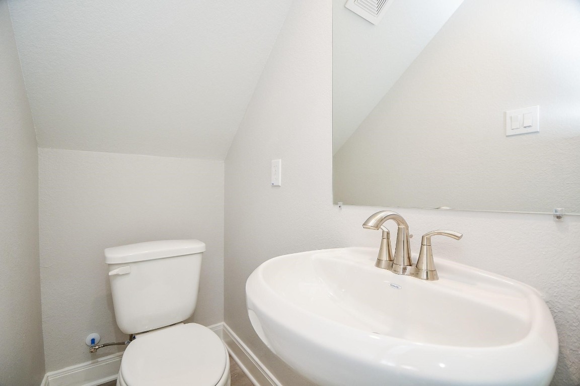 8336 Fountain Street Houston, TX 77051 - Photo 14 of 34 a bathroom with a toilet sink and mirror