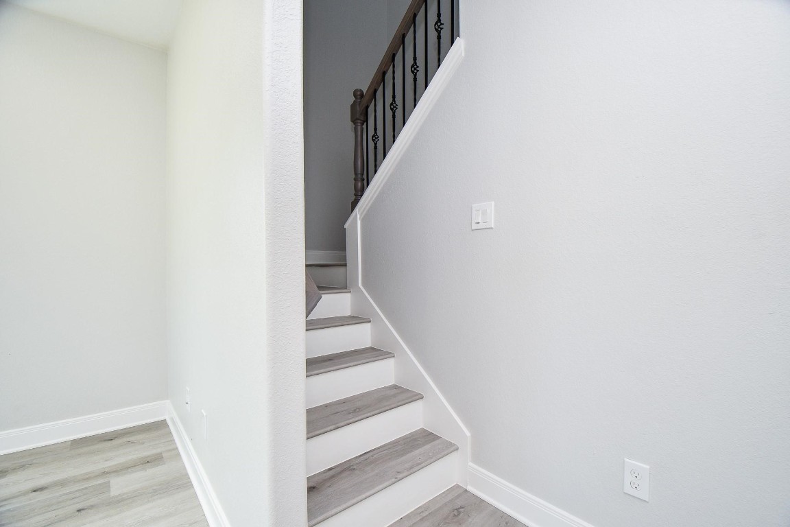 8336 Fountain Street Houston, TX 77051 - Photo 15 of 34 a view of staircase with wooden floor and white walls