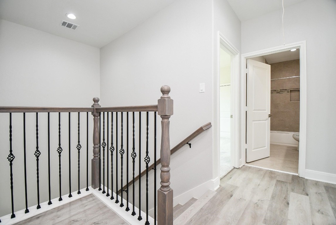 8336 Fountain Street Houston, TX 77051 - Photo 17 of 34 a view of a hallway with wooden floor and entryway