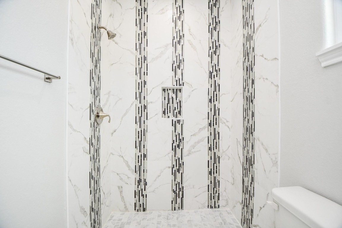8336 Fountain Street Houston, TX 77051 - Photo 20 of 34 a bathroom with a shower curtain and a toilet