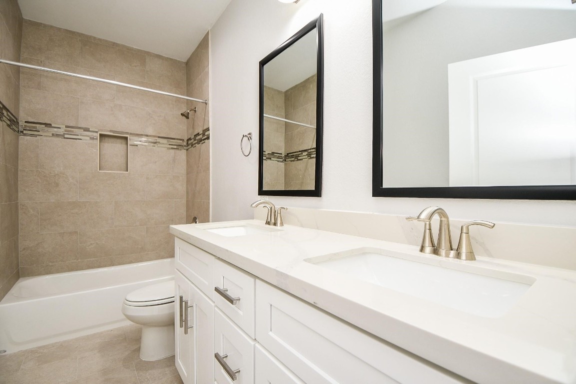 8336 Fountain Street Houston, TX 77051 - Photo 25 of 34 a bathroom with a sink a toilet and shower