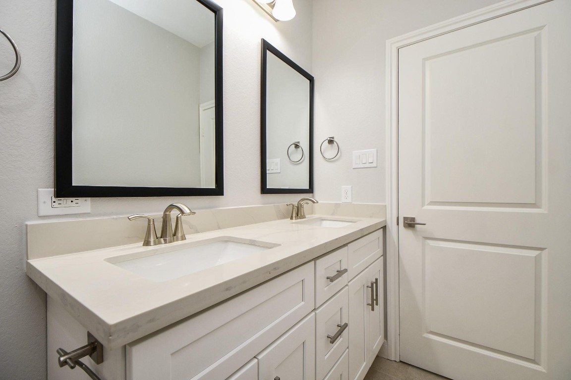 8336 Fountain Street Houston, TX 77051 - Photo 26 of 34 a bathroom with a sink and a mirror