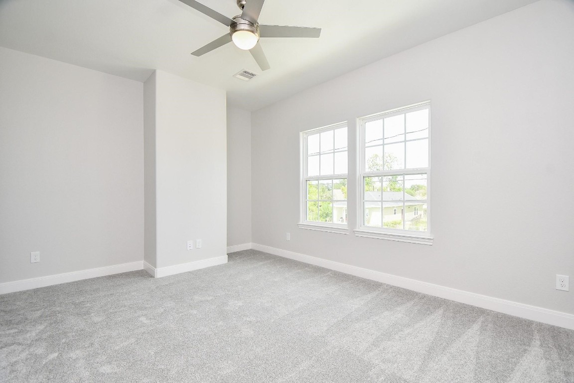 8336 Fountain Street Houston, TX 77051 - Photo 27 of 34 an empty room with a window and a fan
