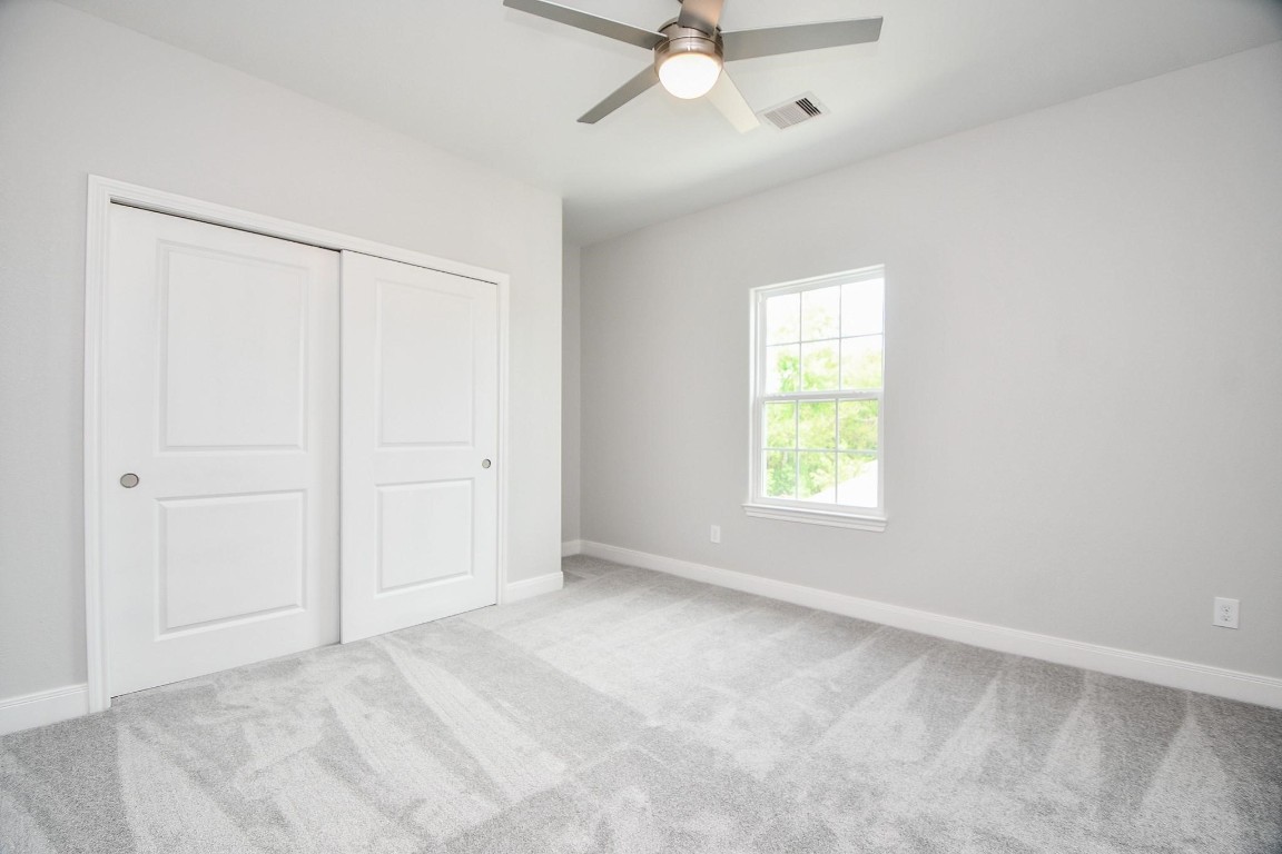 8336 Fountain Street Houston, TX 77051 - Photo 29 of 34 an empty room with a window and a fan