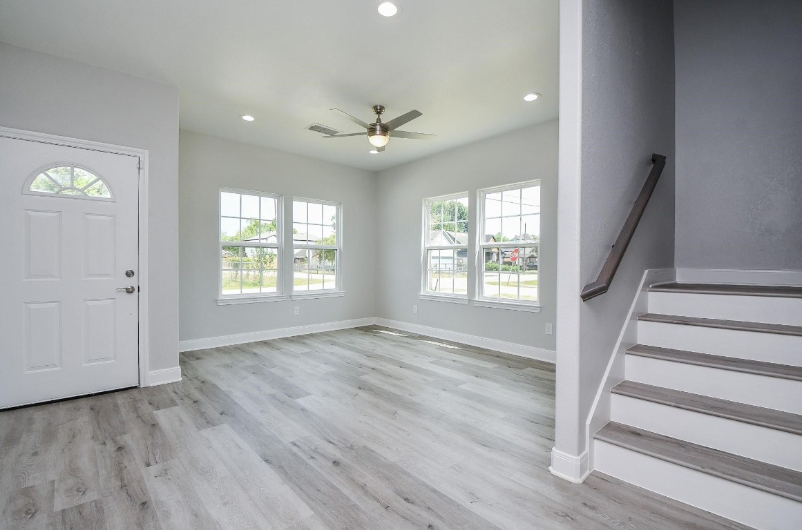 8336 Fountain Street Houston, TX 77051 - Photo 4 of 34 wooden floor in an empty room with a window