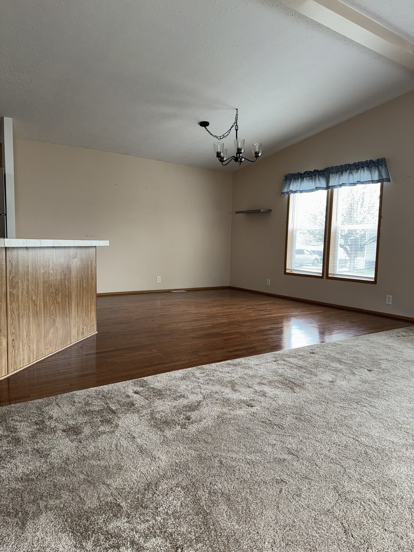 400 James Road Elwood, IL 60421 - Photo 8 of 25 an empty room with windows and entrance