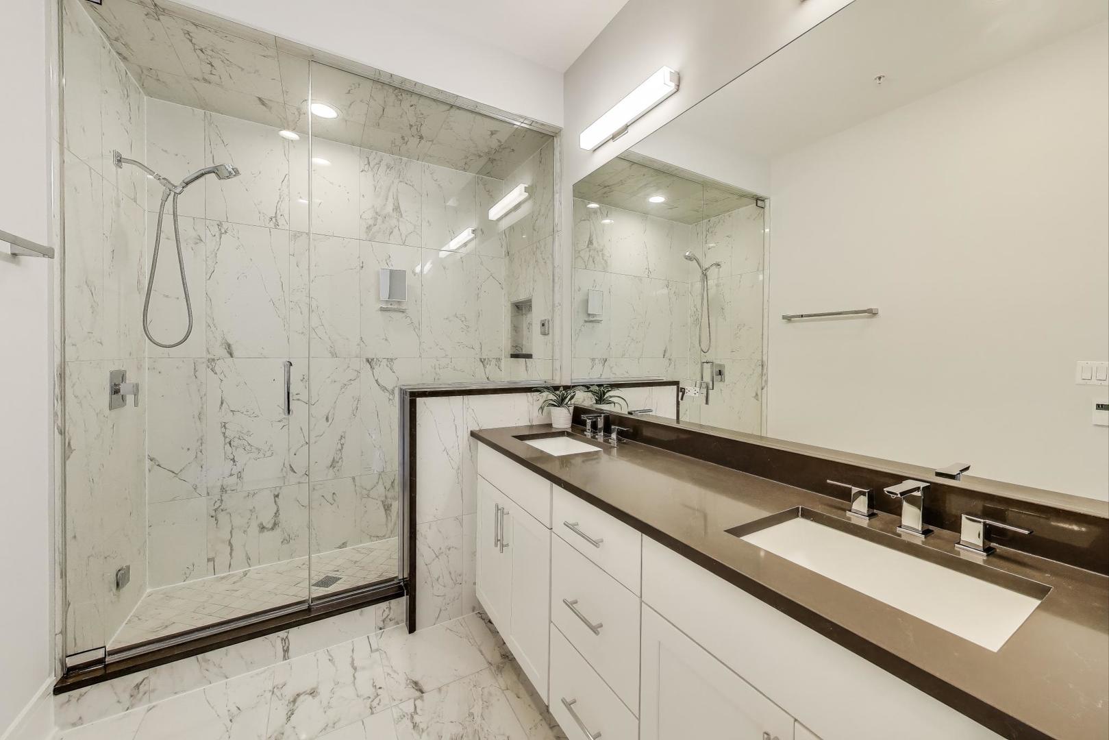 5748 North Hermitage Avenue, Unit 206 Chicago, IL 60660 - Photo 13 of 19 a bathroom with double sink and a mirror