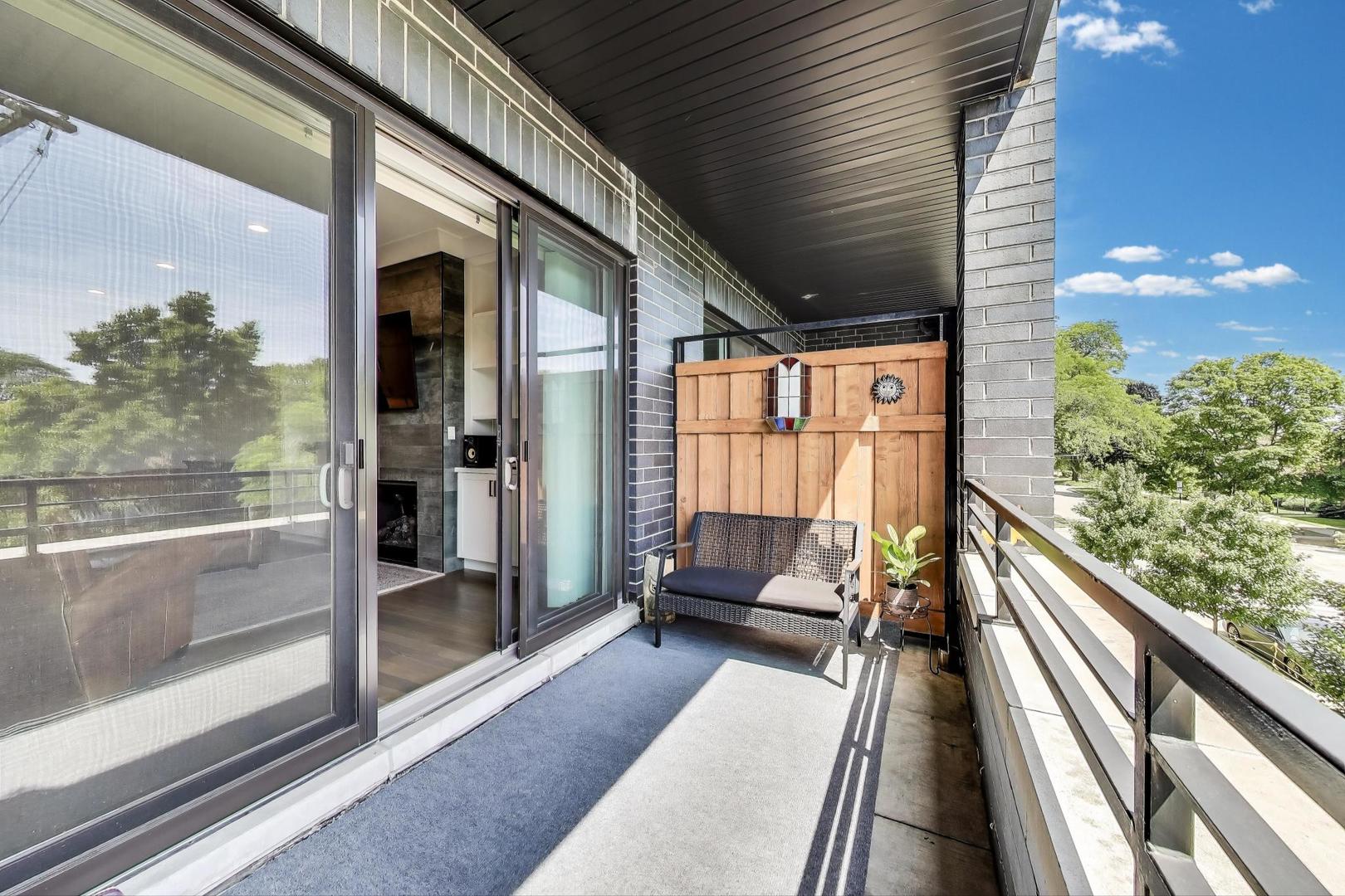 5748 North Hermitage Avenue, Unit 206 Chicago, IL 60660 - Photo 8 of 19 a view of balcony with couch