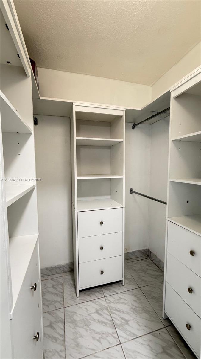 14861 Southwest 173rd Street Miami, FL 33187 - Photo 12 of 24 a view of an empty walk in closet