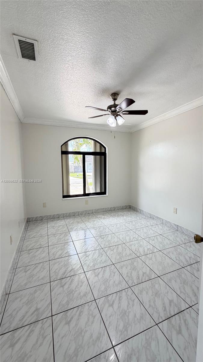 14861 Southwest 173rd Street Miami, FL 33187 - Photo 13 of 24 a view of an empty room with a window