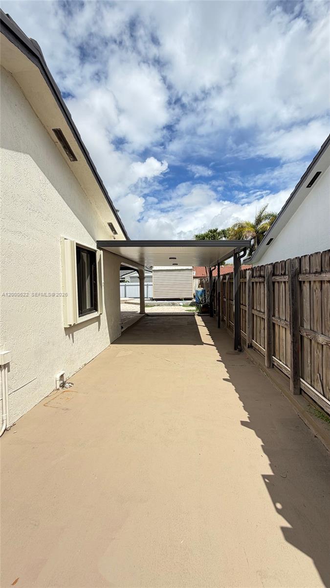 14861 Southwest 173rd Street Miami, FL 33187 - Photo 22 of 24 a view of backyard with small cabin