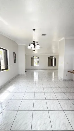 a view of a kitchen with furniture and cabinets