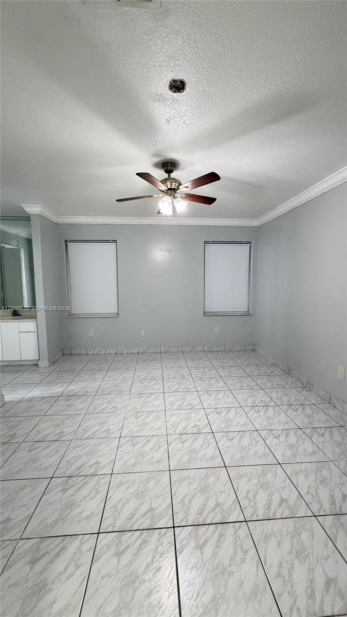 14861 Southwest 173rd Street Miami, FL 33187 - Photo 9 of 24 a view of a room with a ceiling fan