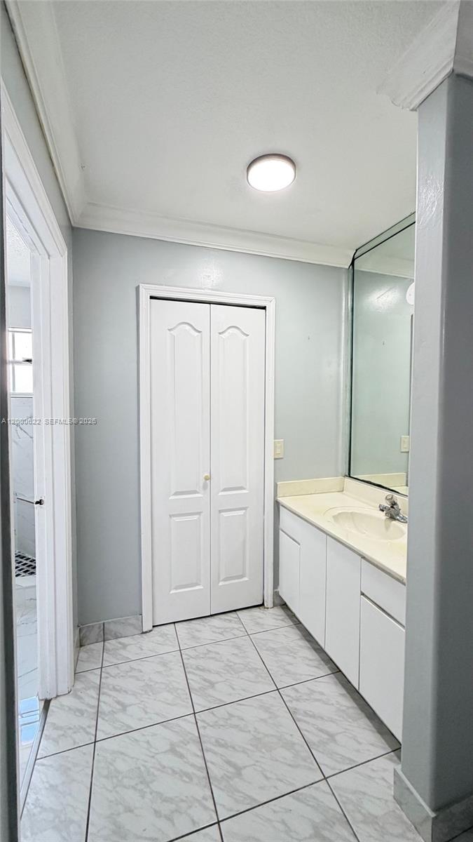 14861 Southwest 173rd Street Miami, FL 33187 - Photo 10 of 24 a spacious bathroom with a granite countertop sink a toilet and mirror