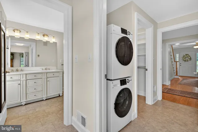 a kitchen with granite countertop a sink and stainless steel appliances