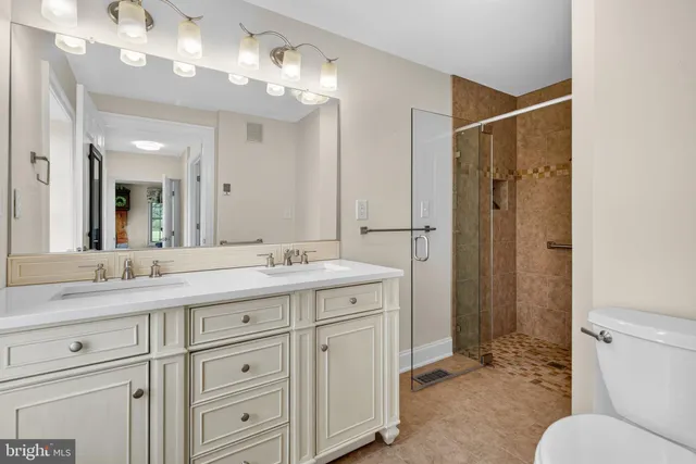 a living room with furniture fireplace and a large window