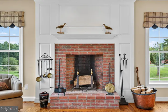 a bathroom with a granite countertop double vanity sink and a mirror