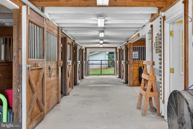 a view of a lush green hillside and houses