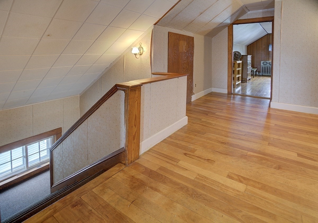 44 Cottage Park Road Winthrop, MA 02152 - Photo 18 of 39 a view of a hallway view with wooden floor and staircase