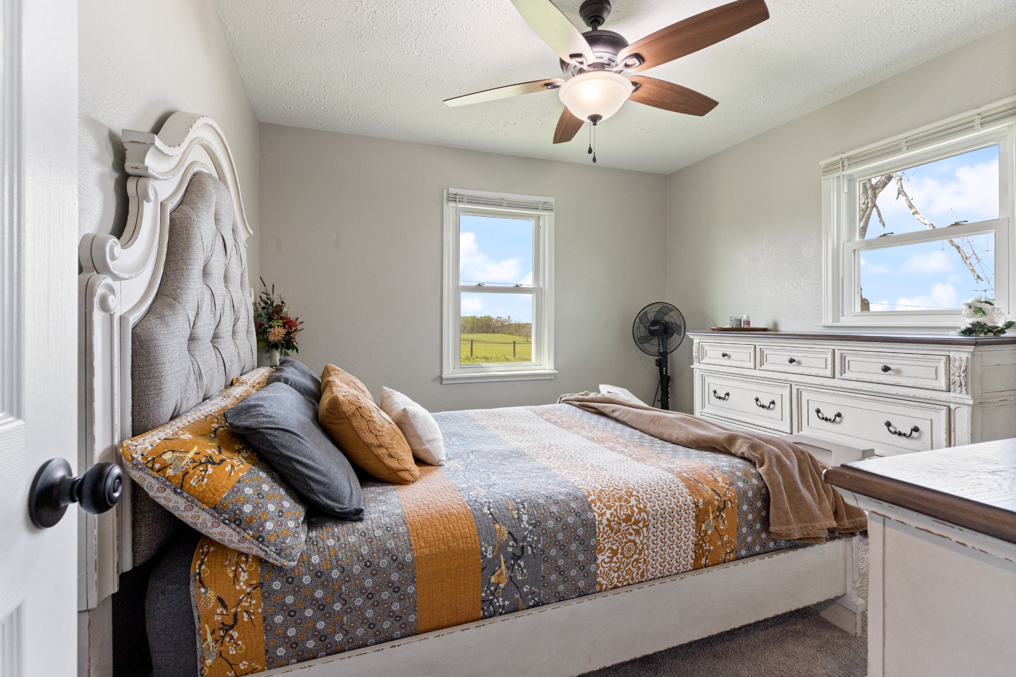 1230 Cooley Ford Road Tennessee Ridge, TN 37178 - Photo 20 of 30 a bedroom with a bed and a chandelier